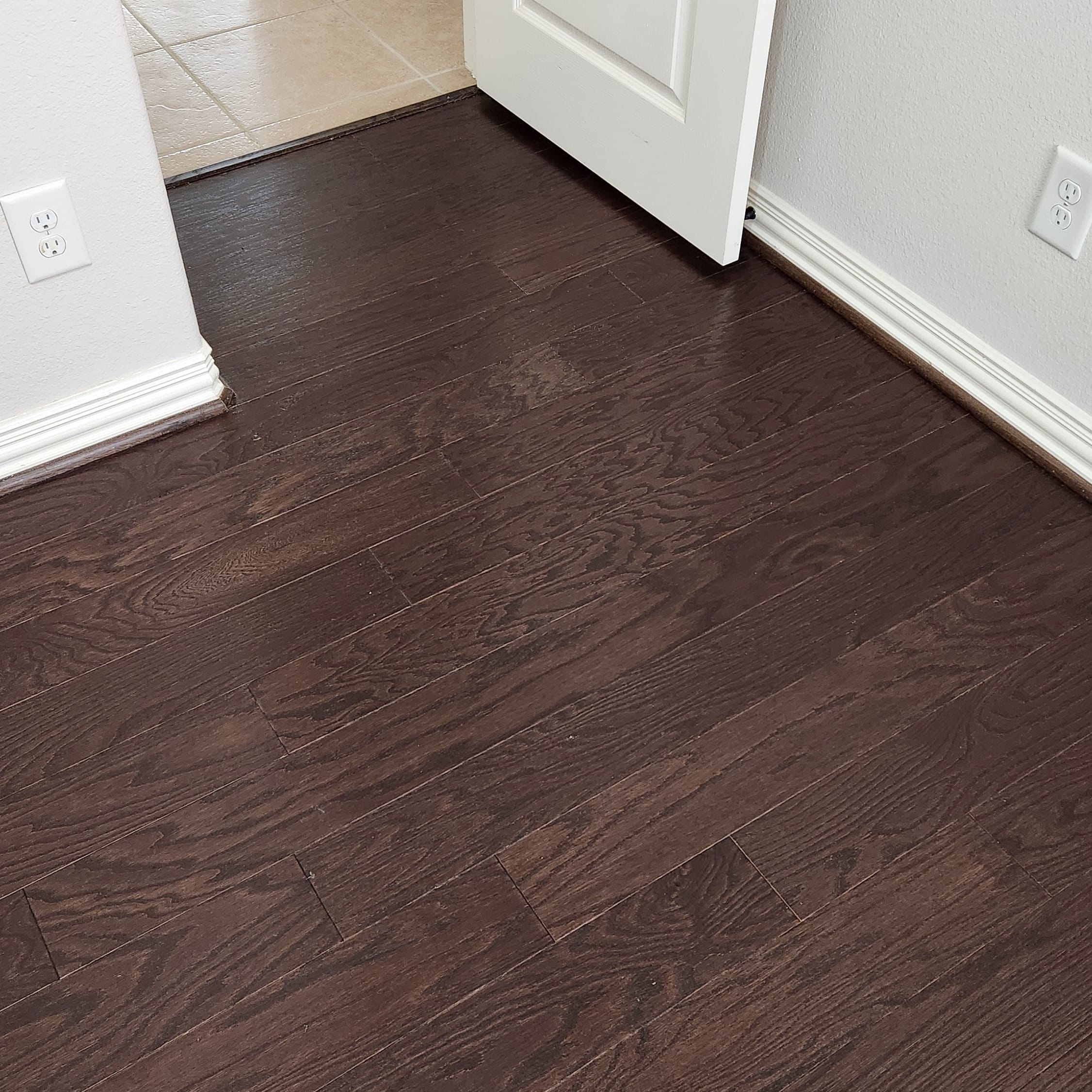bedroom wood flooring in Cypress TX after professional wood floor cleaning with improved shine, clearer tone, and a cleaner overall appearance