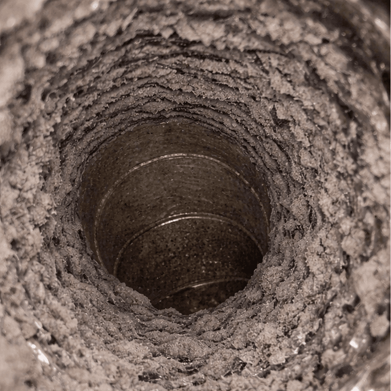 lint-heavy dryer vent in a Sugar Land TX laundry room before professional dryer vent cleaning