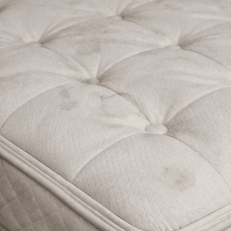 stained mattress in a Sugar Land TX bedroom before professional mattress cleaning